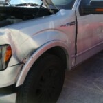 Before and after photographs of a damaged Ford pickup truck that was repaired by Elite Paint & Body Shop in West Palm Beach, Florida.